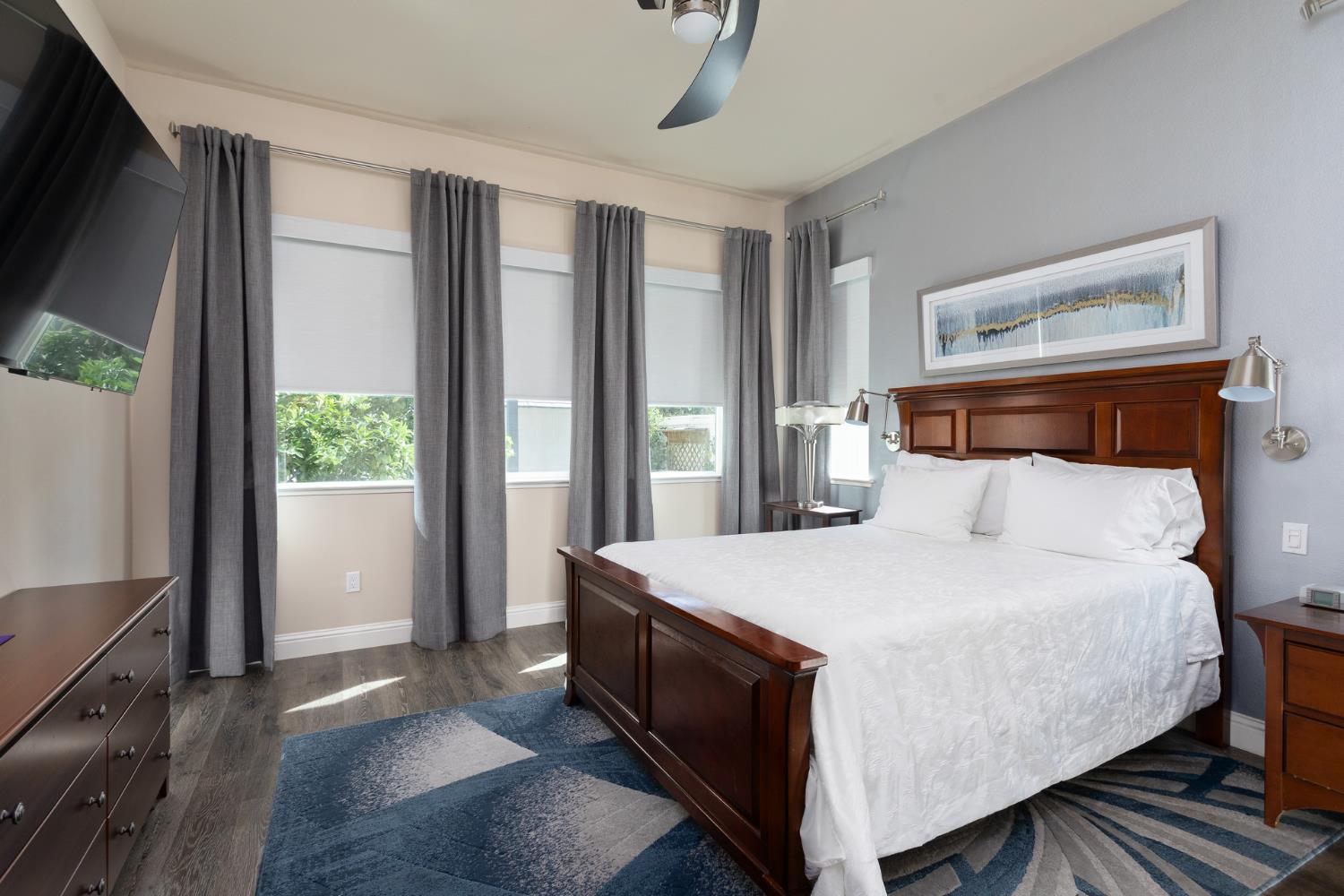 2227 North Highland Avenue Clovis, CA 93619 - Photo 16 of 48 a large bed sitting in a bedroom next to a window