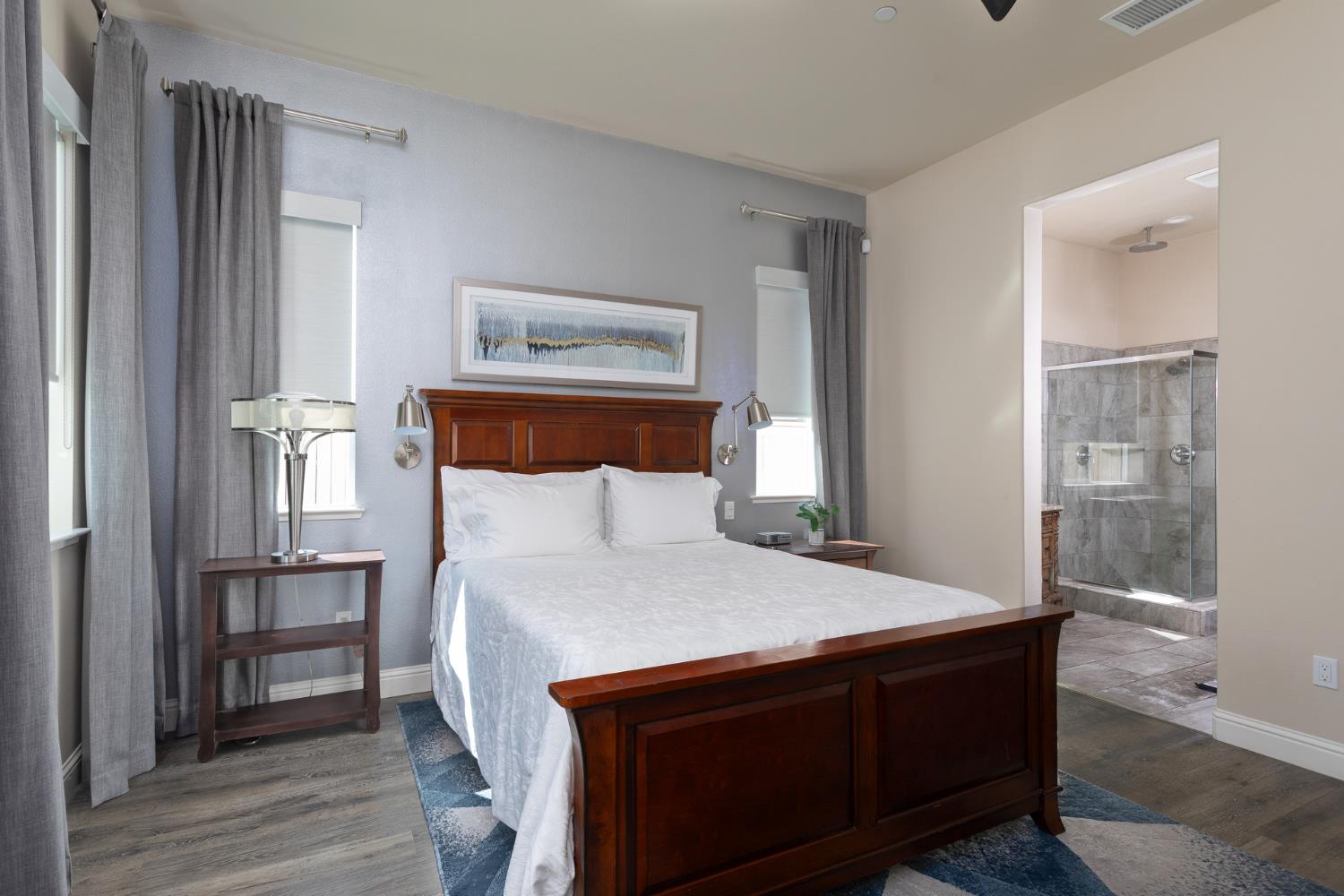 2227 North Highland Avenue Clovis, CA 93619 - Photo 17 of 48 a bed sitting in a bedroom next to a window