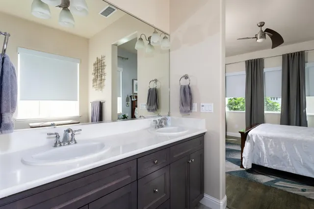 a bathroom with a shower and a sink