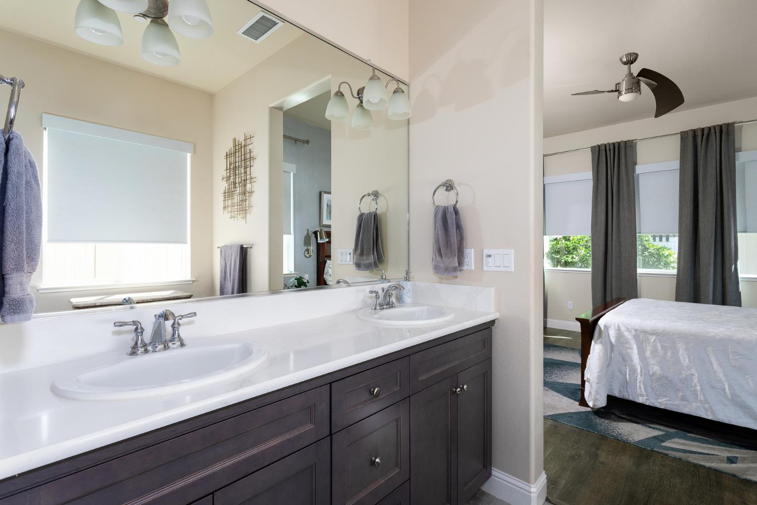 2227 North Highland Avenue Clovis, CA 93619 - Photo 20 of 48 a en suite bathroom with a double vanity sink and a mirror