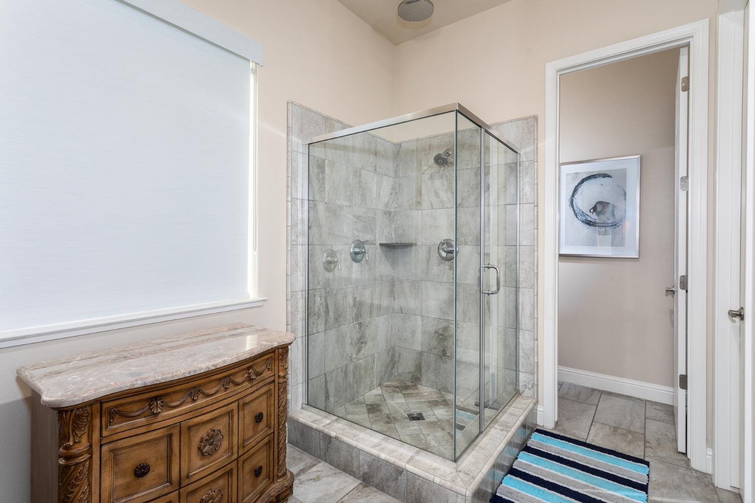 2227 North Highland Avenue Clovis, CA 93619 - Photo 21 of 48 a bathroom with a shower and a sink