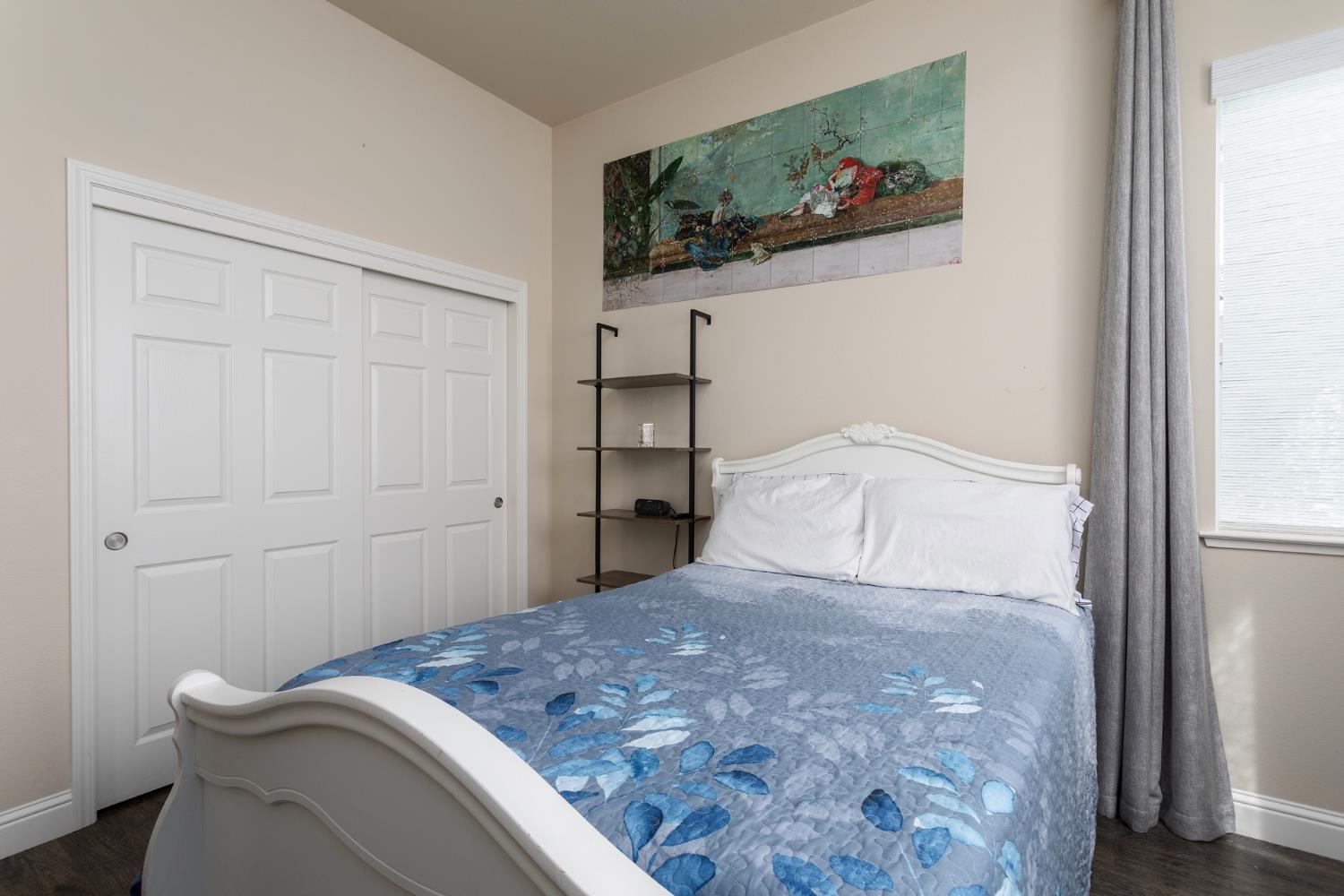 2227 North Highland Avenue Clovis, CA 93619 - Photo 29 of 48 a bedroom with a bed and painting on the wall