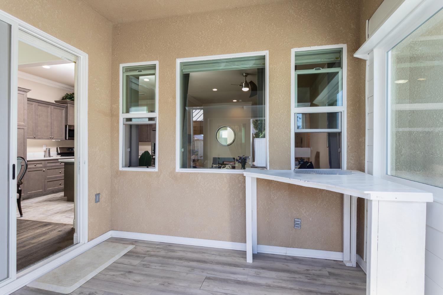 2227 North Highland Avenue Clovis, CA 93619 - Photo 33 of 48 hallway with wooden floor and glass door