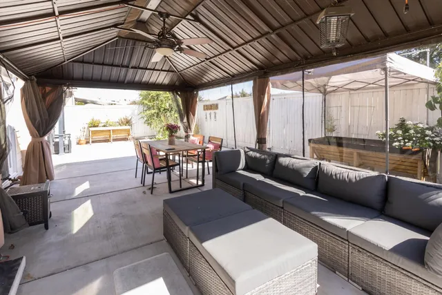 a living room with furniture a window and outdoor view
