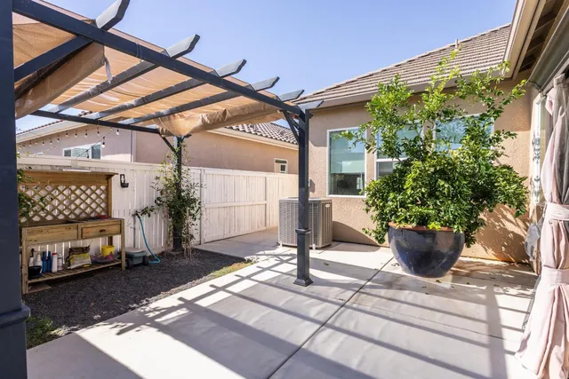 a house view with a wooden deck