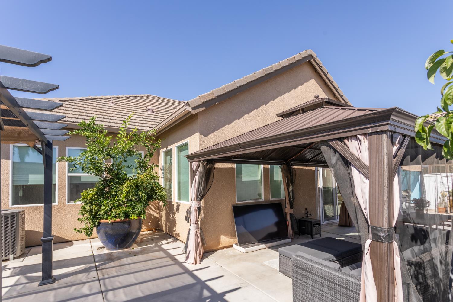 2227 North Highland Avenue Clovis, CA 93619 - Photo 44 of 48 a view of house with potted plants