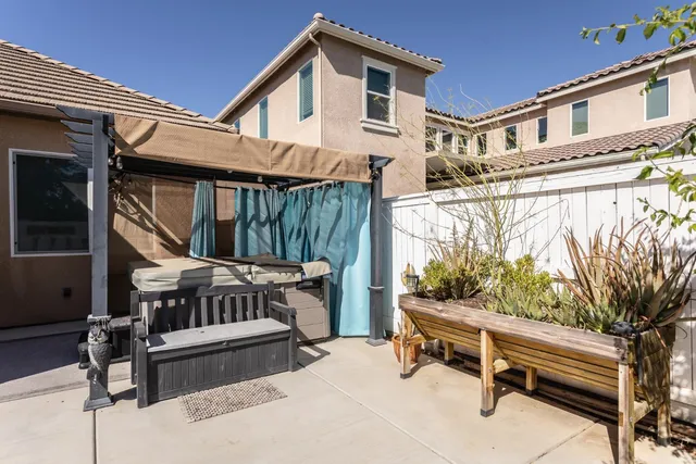 a view of a house with wooden floor and fence
