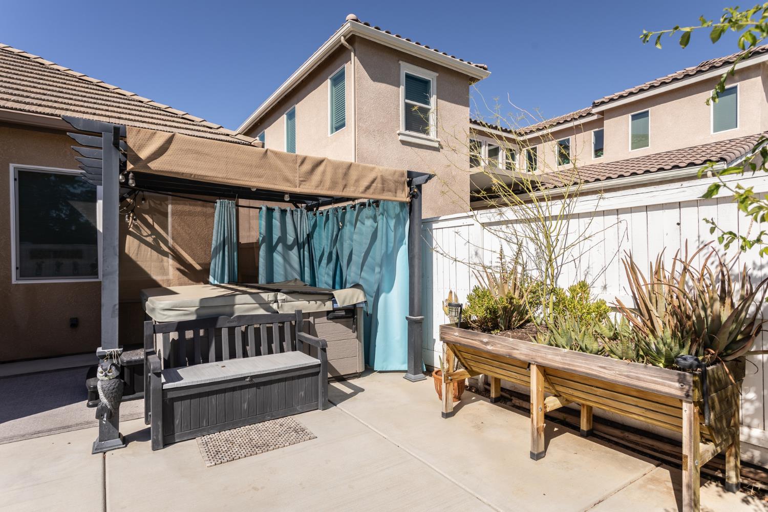 2227 North Highland Avenue Clovis, CA 93619 - Photo 47 of 48 a view of a roof deck with wooden fence and a bench