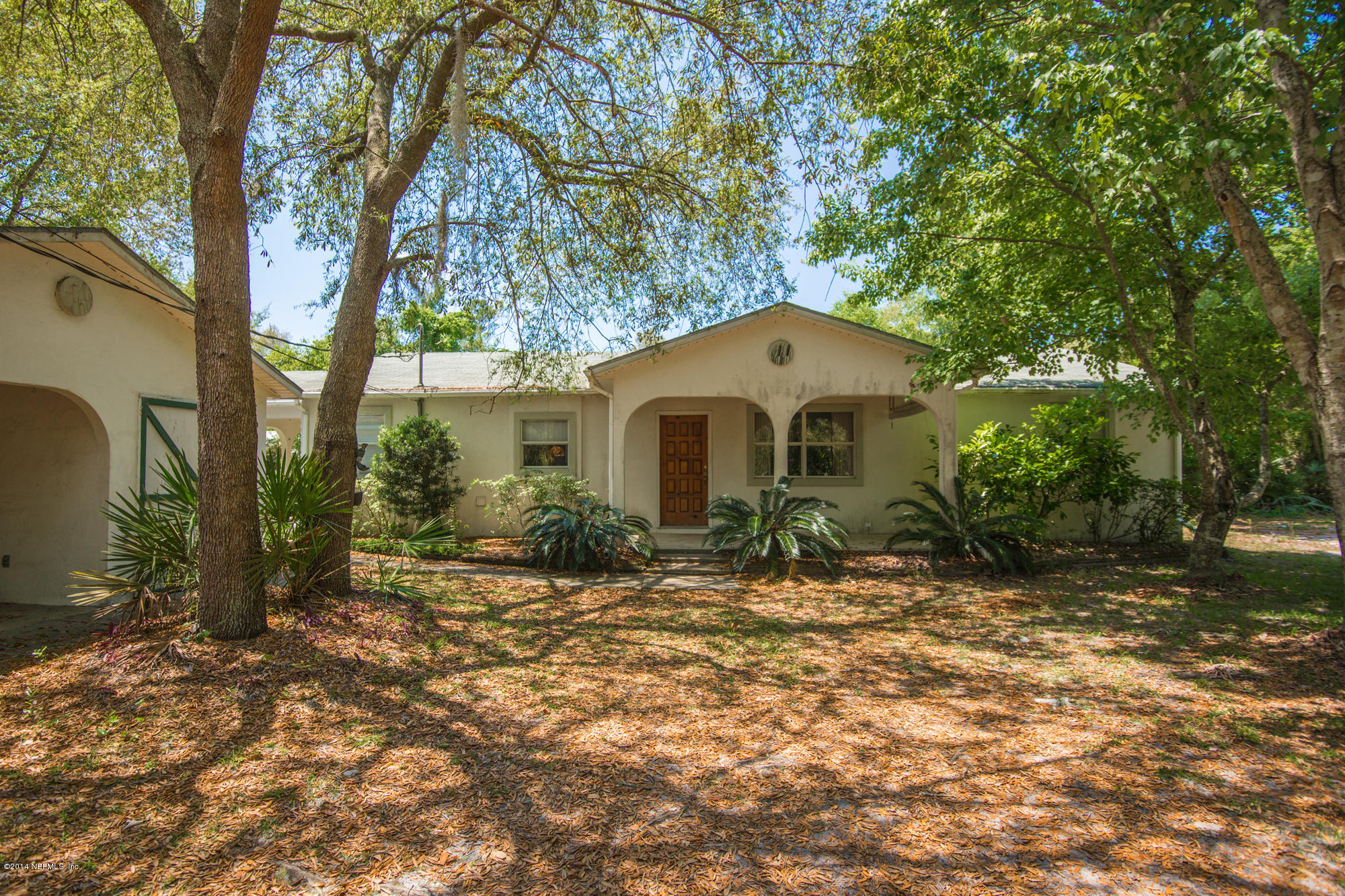 865 Kings Estate Road St. Augustine, FL 32086 - Photo 1 of 24 a front view of a house with a yard