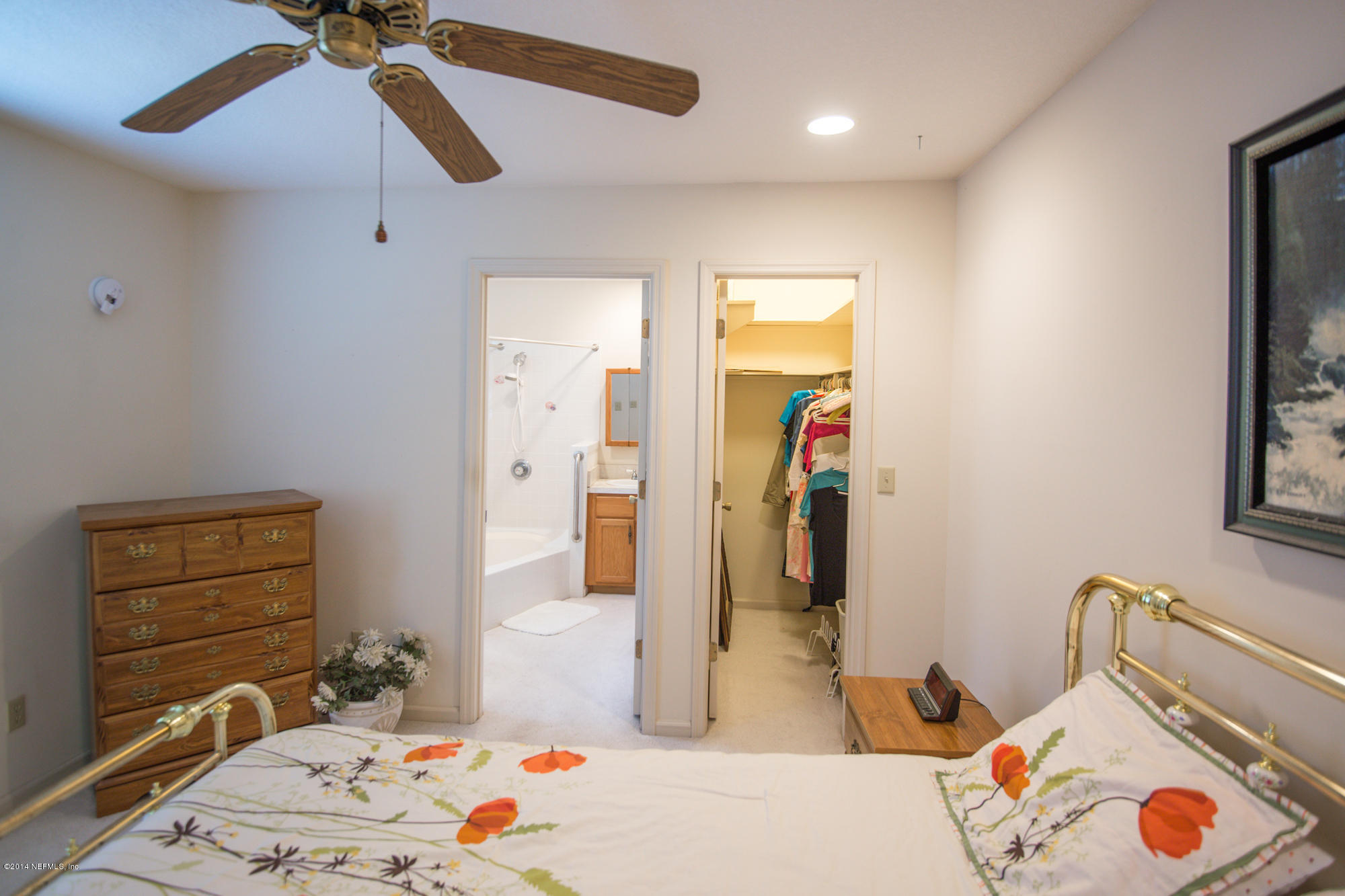 865 Kings Estate Road St. Augustine, FL 32086 - Photo 13 of 24 a bedroom with a bed and a dresser