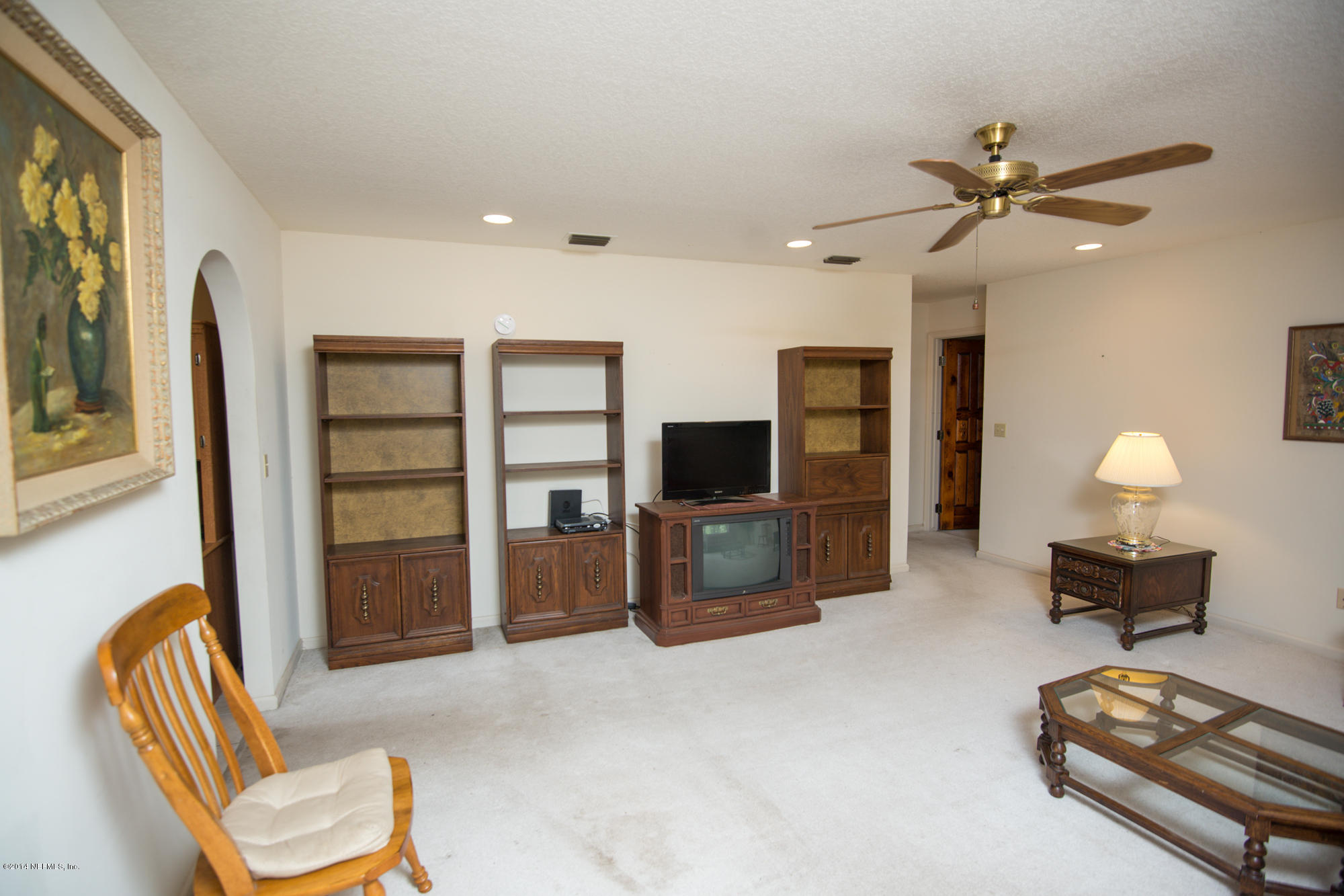 865 Kings Estate Road St. Augustine, FL 32086 - Photo 4 of 24 a living room with furniture and a flat screen tv
