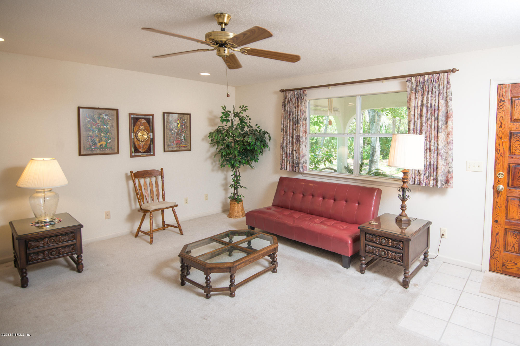 865 Kings Estate Road St. Augustine, FL 32086 - Photo 5 of 24 a living room with furniture and a large window