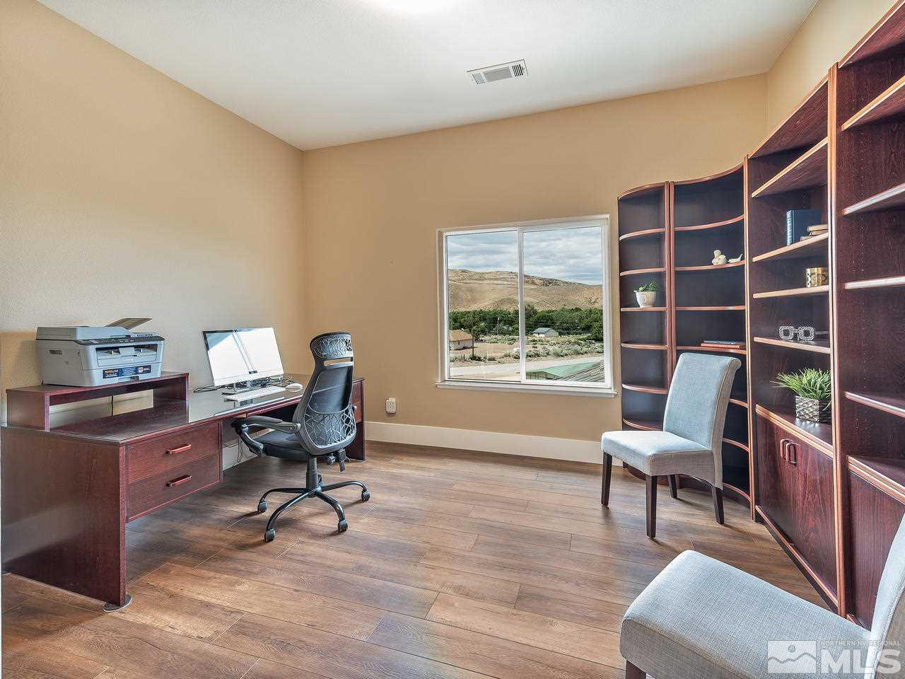 300 Andrew Lane Reno, NV 89521 - Photo 12 of 25 a work room with furniture and a bookshelf