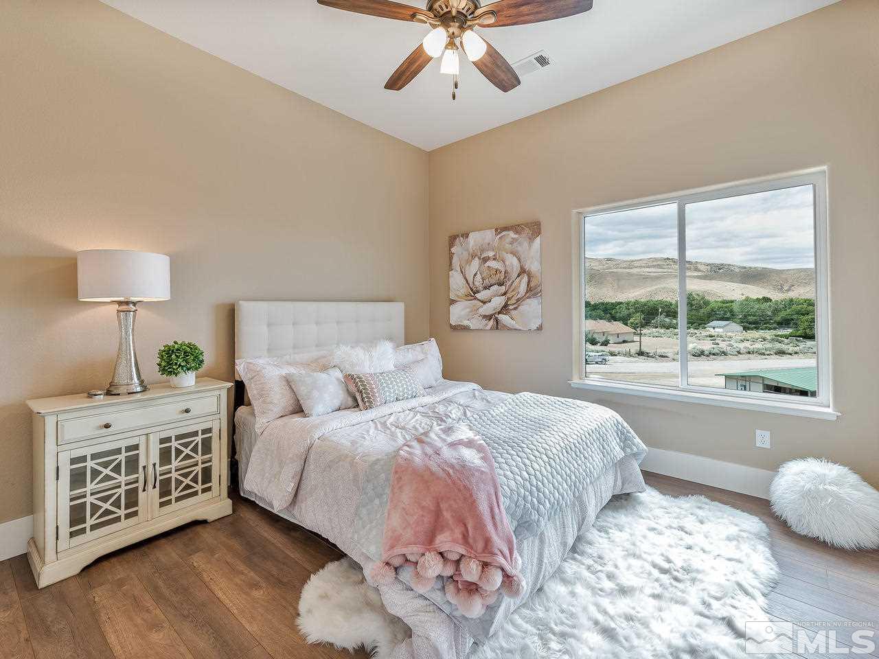 300 Andrew Lane Reno, NV 89521 - Photo 13 of 25 a bedroom with a bed and a window