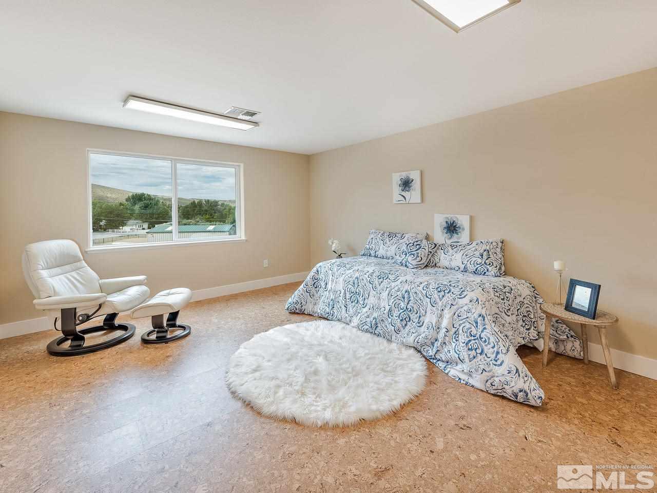 300 Andrew Lane Reno, NV 89521 - Photo 18 of 25 a bedroom with a bed and a window