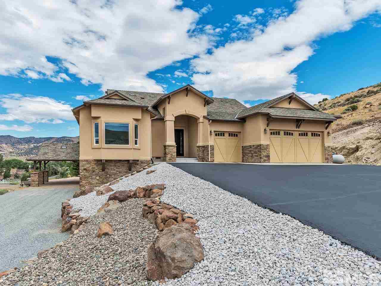 300 Andrew Lane Reno, NV 89521 - Photo 2 of 25 a front view of a house with a yard