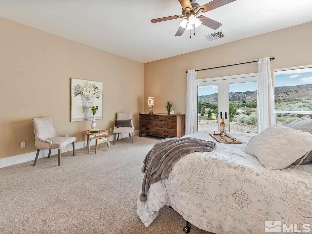 300 Andrew Lane Reno, NV 89521 - Photo 10 of 25 a bedroom with a bed and a large window