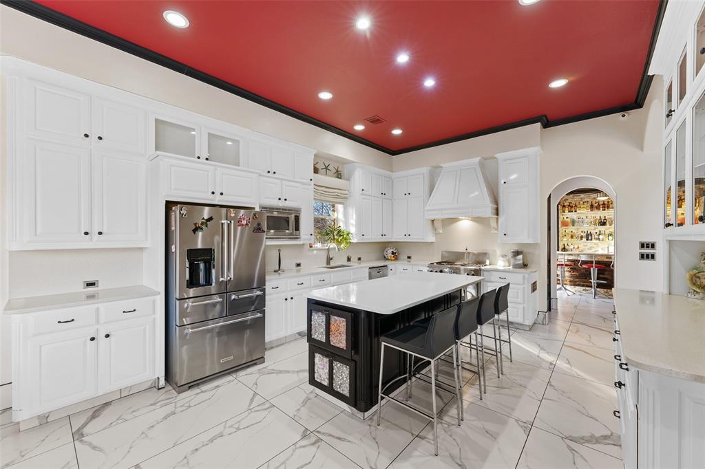 3310 Collard Road Arlington, TX 76017 - Photo 13 of 40 a kitchen with stainless steel appliances kitchen island granite countertop a refrigerator and cabinets