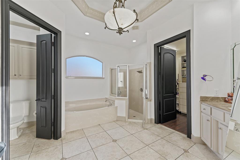 3310 Collard Road Arlington, TX 76017 - Photo 16 of 40 a bathroom with a tub sink and a mirror