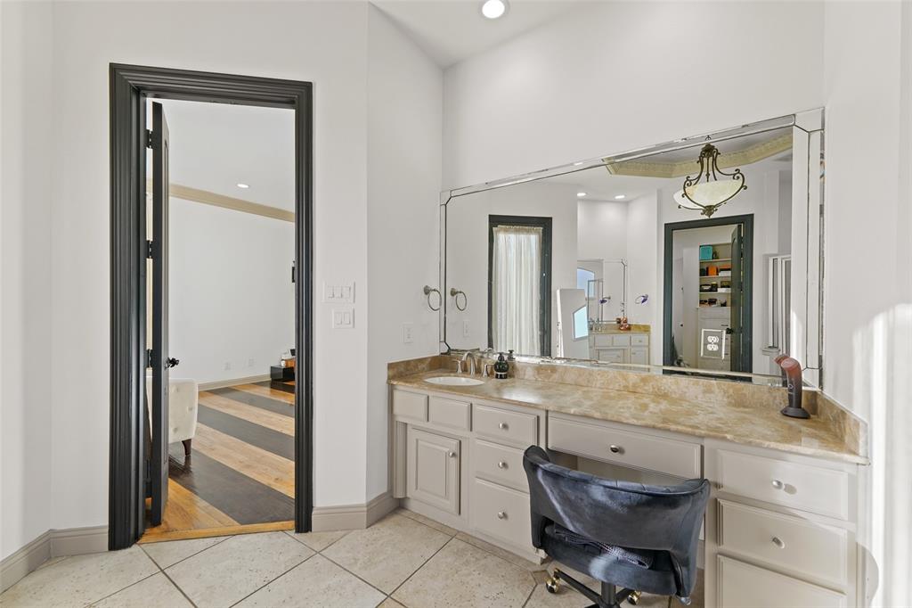 3310 Collard Road Arlington, TX 76017 - Photo 17 of 40 a en suite bathroom with a granite countertop sink and a mirror