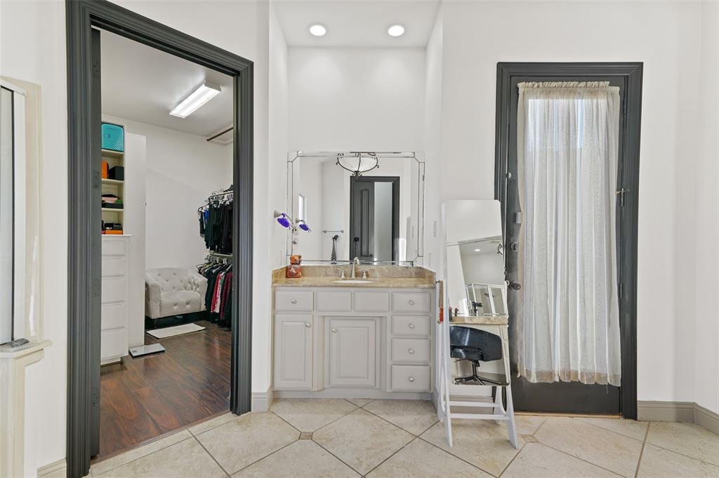 3310 Collard Road Arlington, TX 76017 - Photo 18 of 40 a bathroom with a sink vanity and mirror