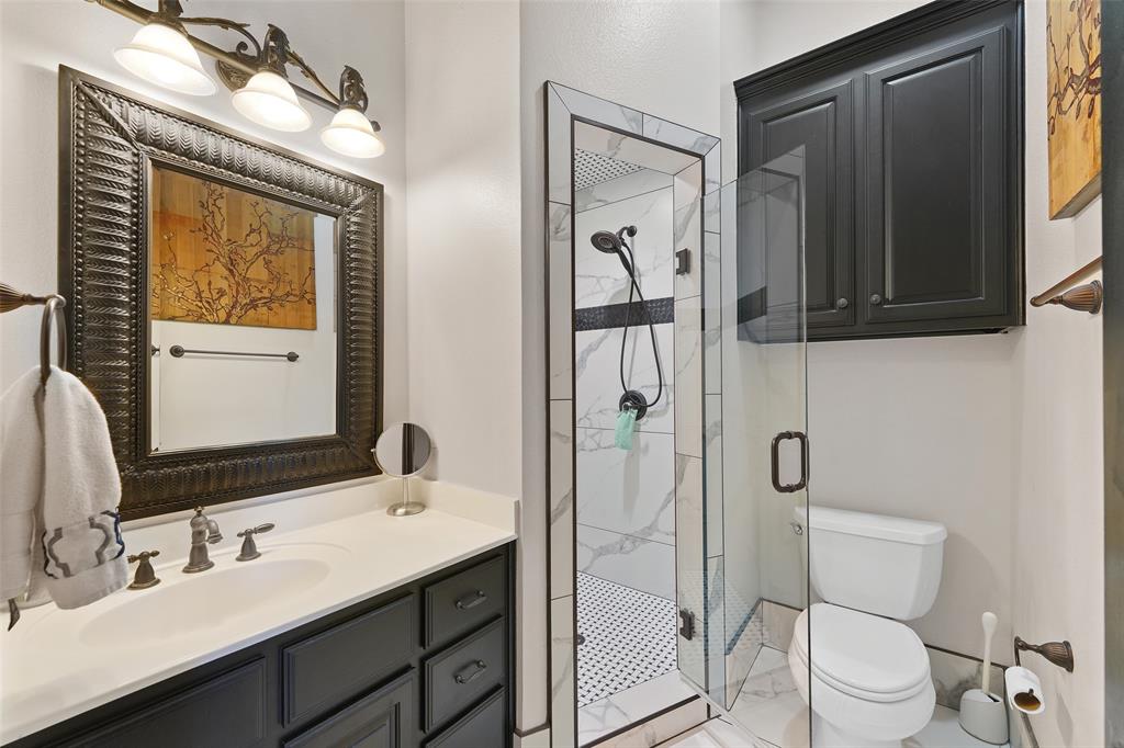 3310 Collard Road Arlington, TX 76017 - Photo 20 of 40 a bathroom with a toilet a sink and mirror