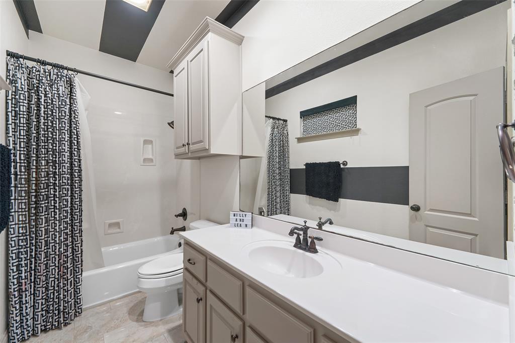 3310 Collard Road Arlington, TX 76017 - Photo 28 of 40 a bathroom with a sink toilet double vanity and shower