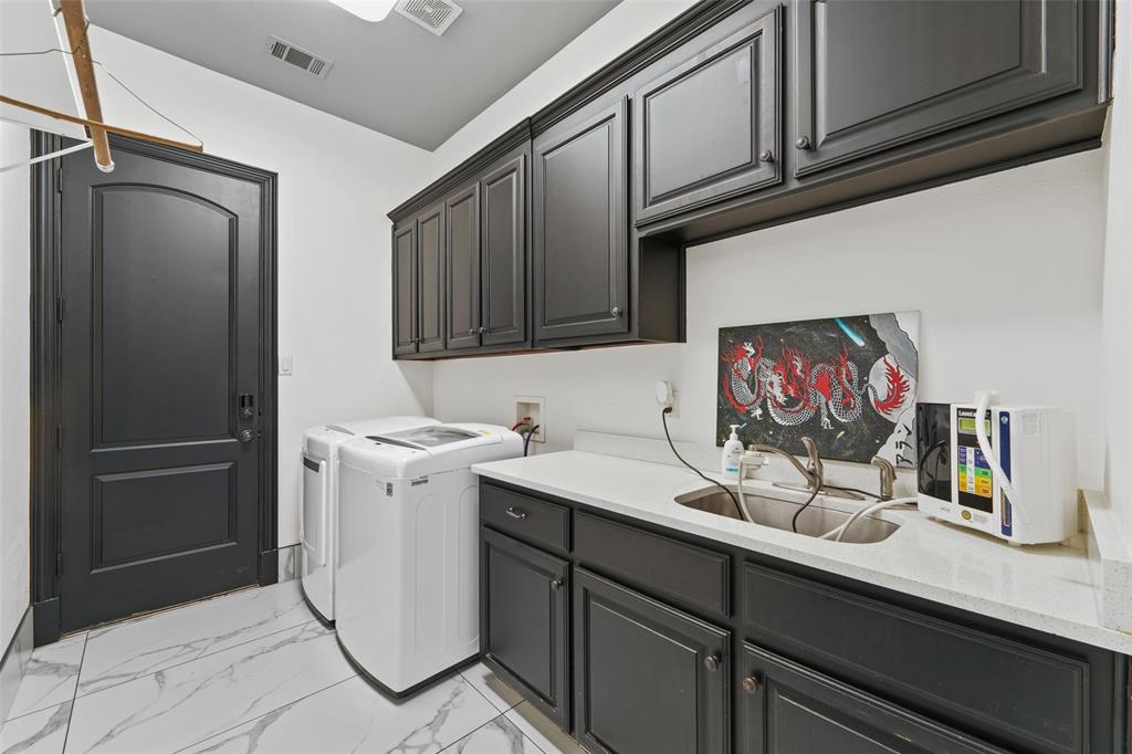 3310 Collard Road Arlington, TX 76017 - Photo 29 of 40 a kitchen with stainless steel appliances granite countertop a refrigerator and a sink