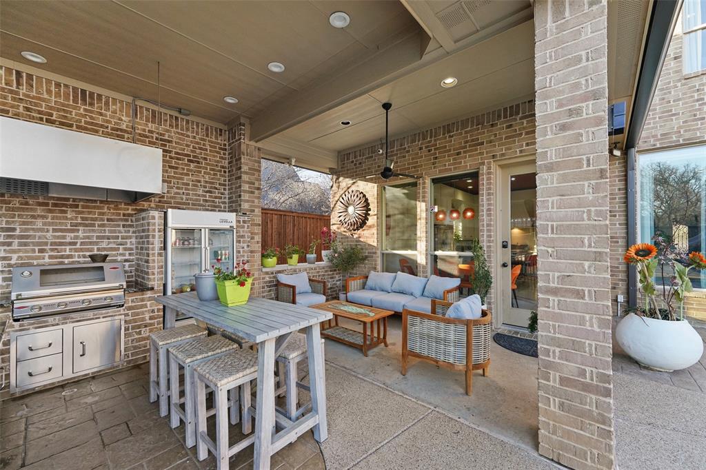 3310 Collard Road Arlington, TX 76017 - Photo 31 of 40 a kitchen with stainless steel appliances kitchen island granite countertop a table and chairs in it