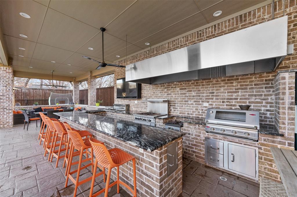 3310 Collard Road Arlington, TX 76017 - Photo 32 of 40 a kitchen with stainless steel appliances granite countertop a sink and a stove