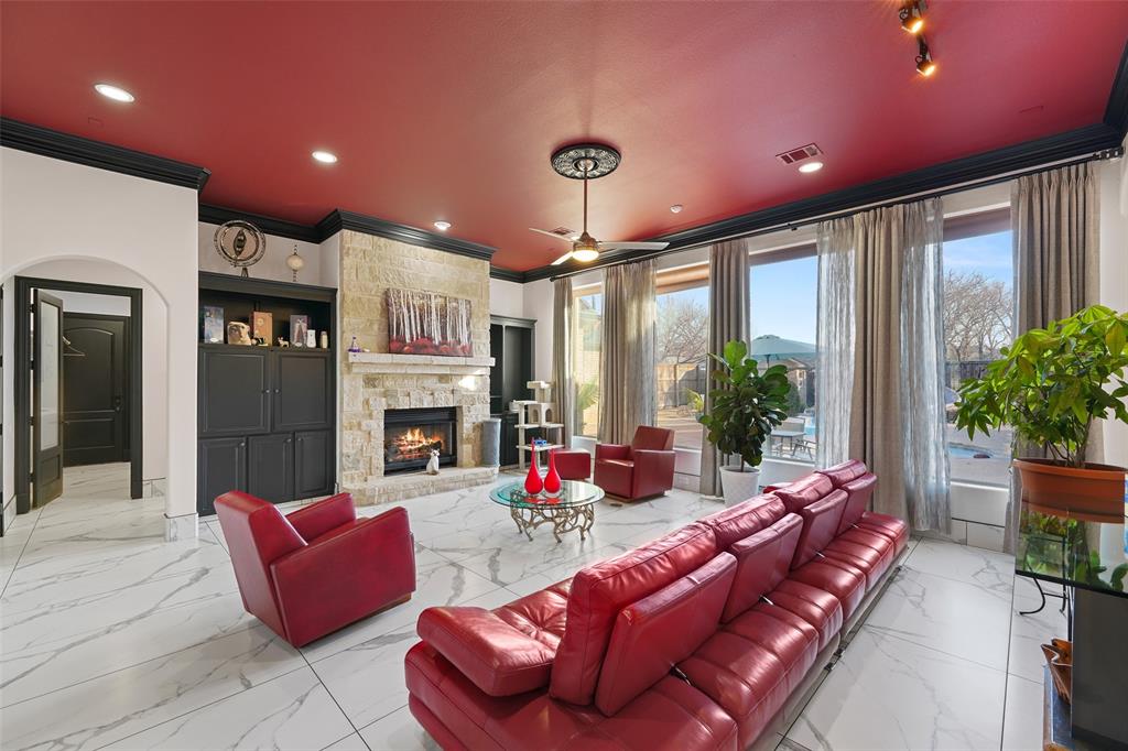 3310 Collard Road Arlington, TX 76017 - Photo 9 of 40 a living room with furniture fireplace and potted plants