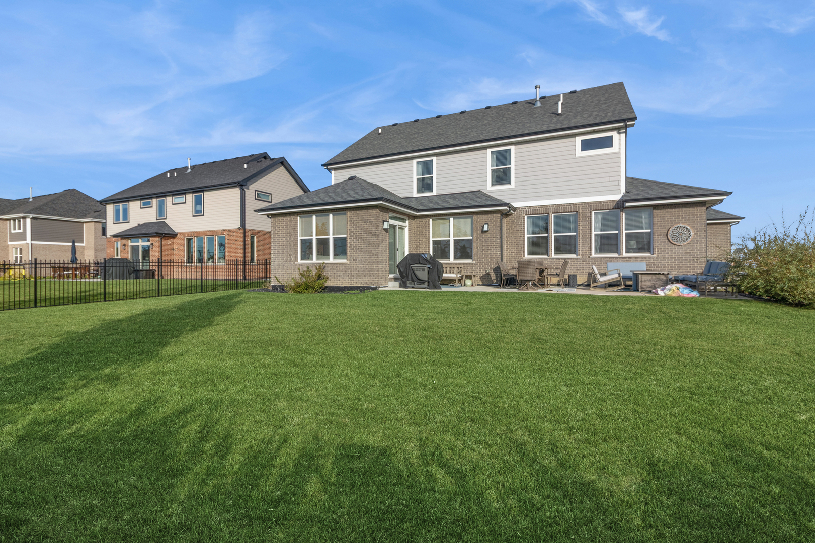 1647 Cobb Street New Lenox, IL 60451 - Photo 29 of 30 a front view of a house with a garden and plants