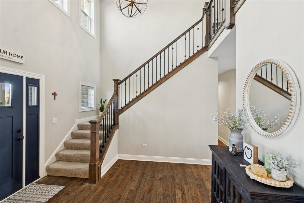 1647 Cobb Street New Lenox, IL 60451 - Photo 3 of 30 a view of entryway with wooden floor and front door