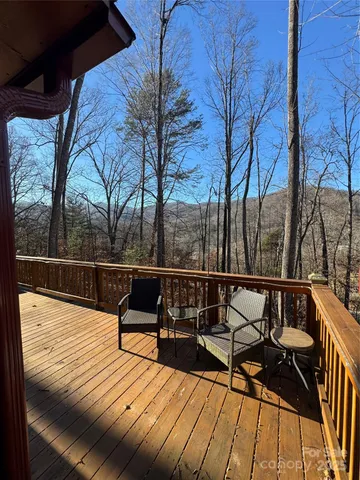 a red and white house with a trees in front of it