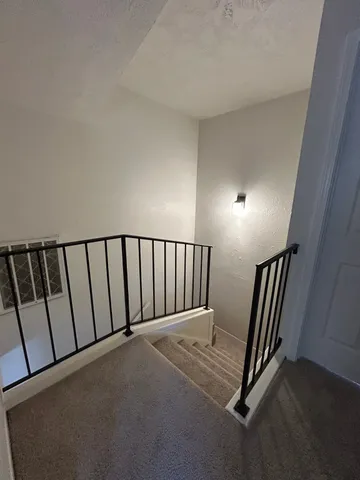 a view of a hallway with staircase