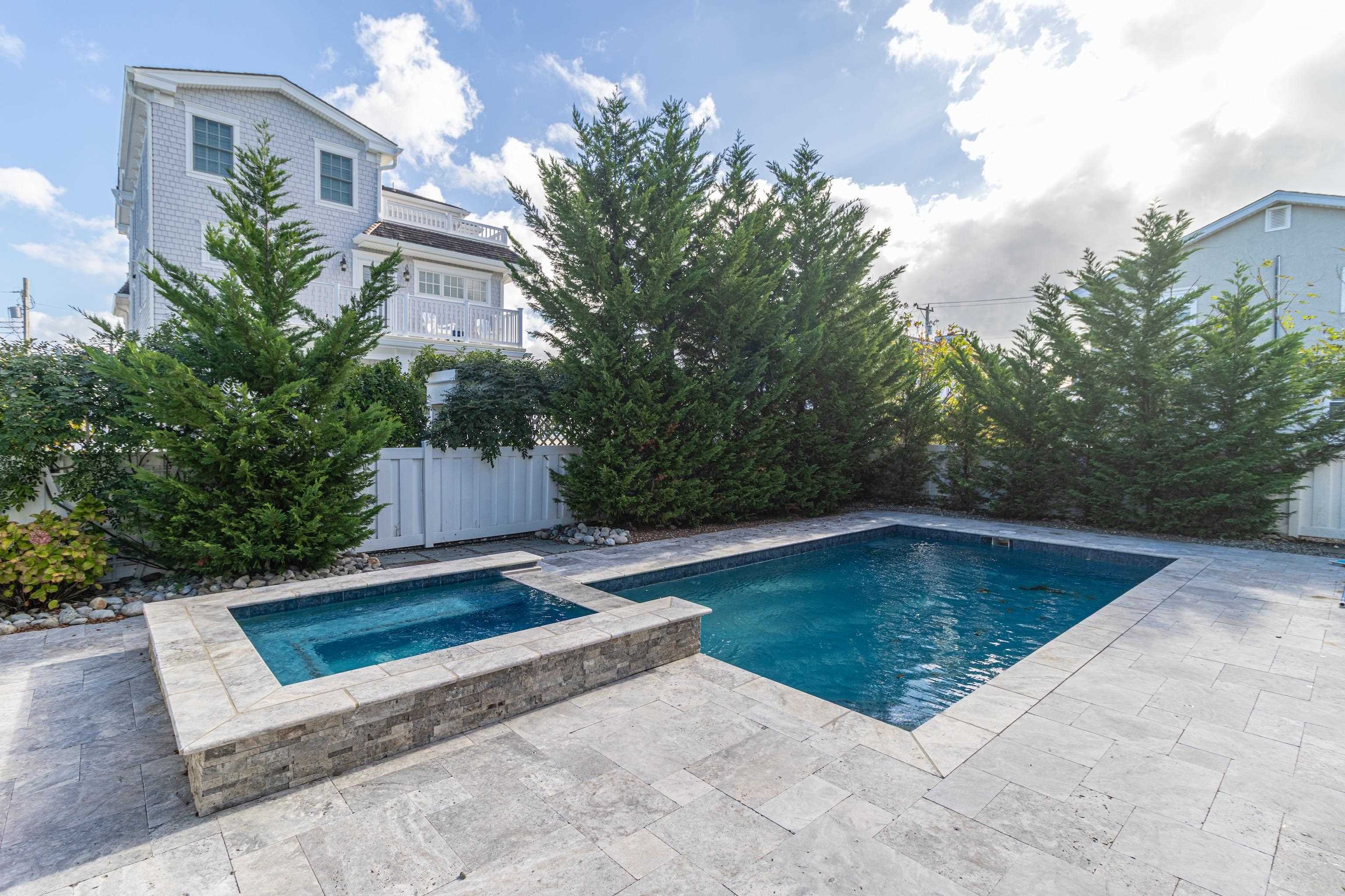 25 West 32nd Avalon, NJ 08202 - Photo 12 of 40 a view of a swimming pool with an outdoor seating