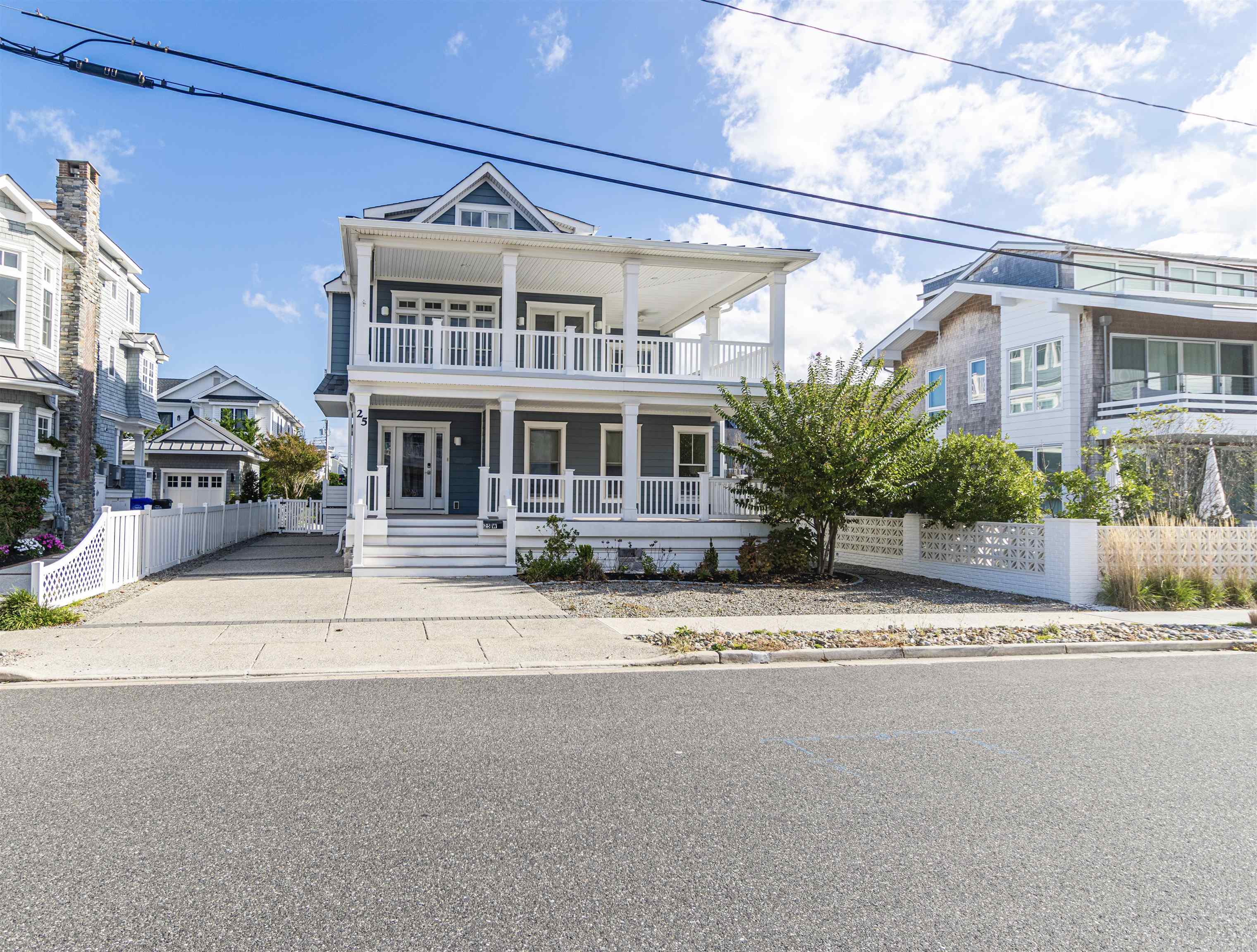 25 West 32nd Avalon, NJ 08202 - Photo 13 of 40 a front view of a building with a street