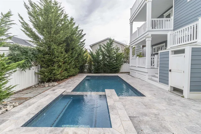 a view of a bedroom with wooden floor