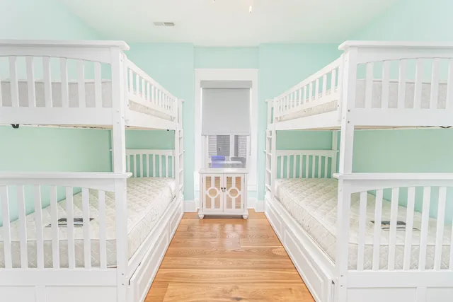 a bedroom with a bed and a chair