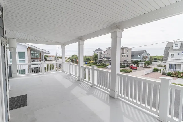 a view of a balcony with potted plants