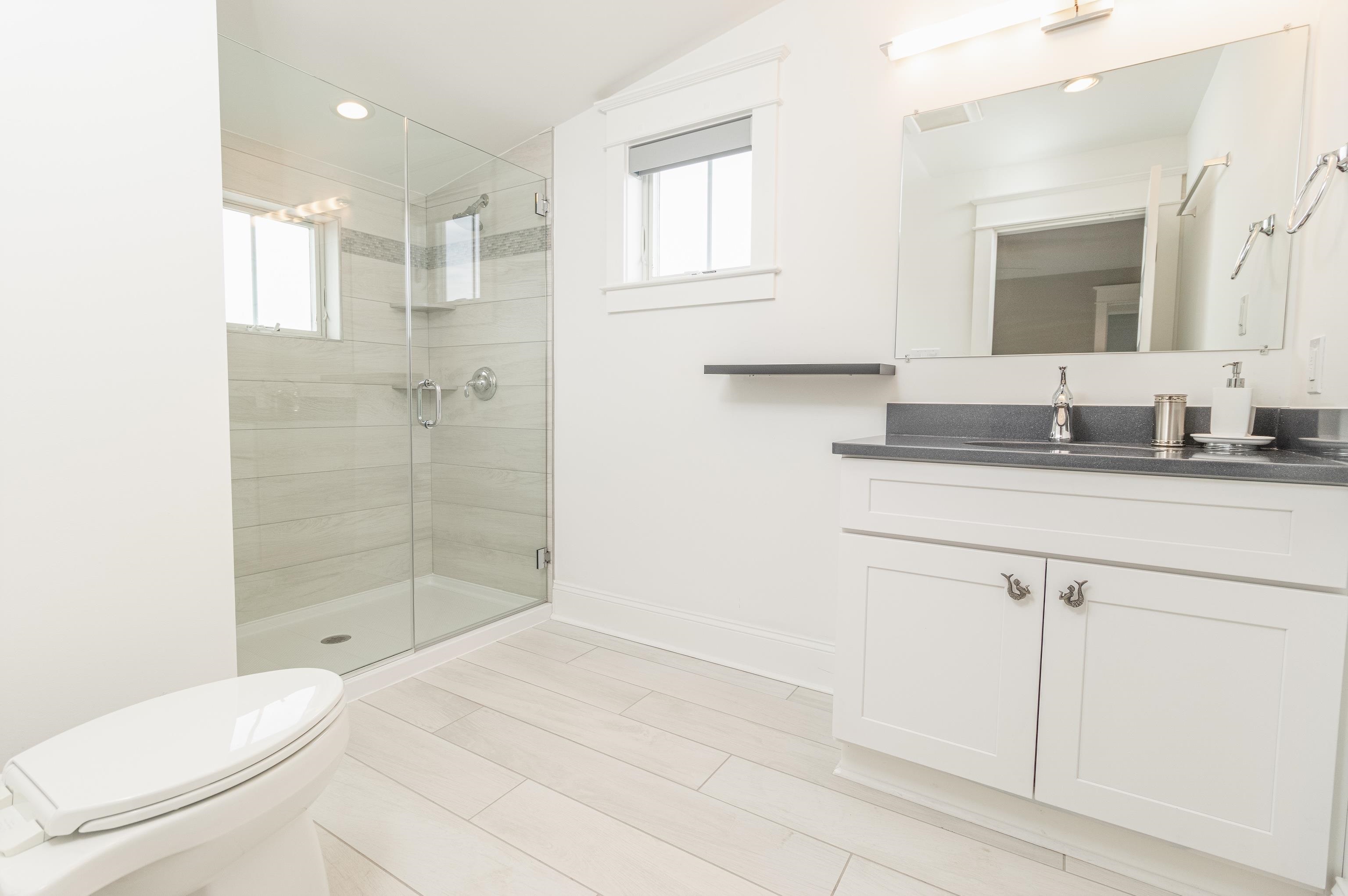 25 West 32nd Avalon, NJ 08202 - Photo 34 of 40 a bathroom with a sink a toilet and shower
