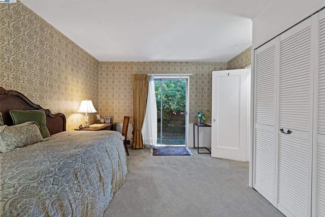 a bed room with double bed and a window