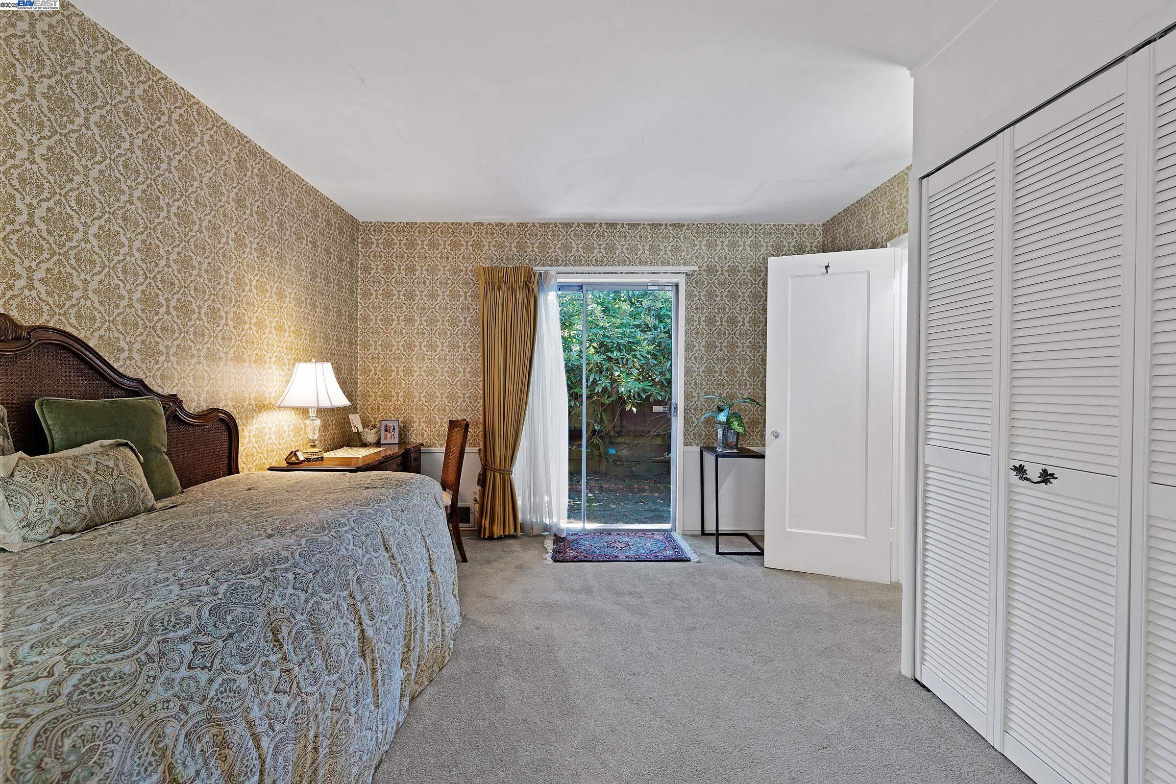 2863 Burton Drive Oakland, CA 94611 - Photo 15 of 34 a bed room with double bed and a window