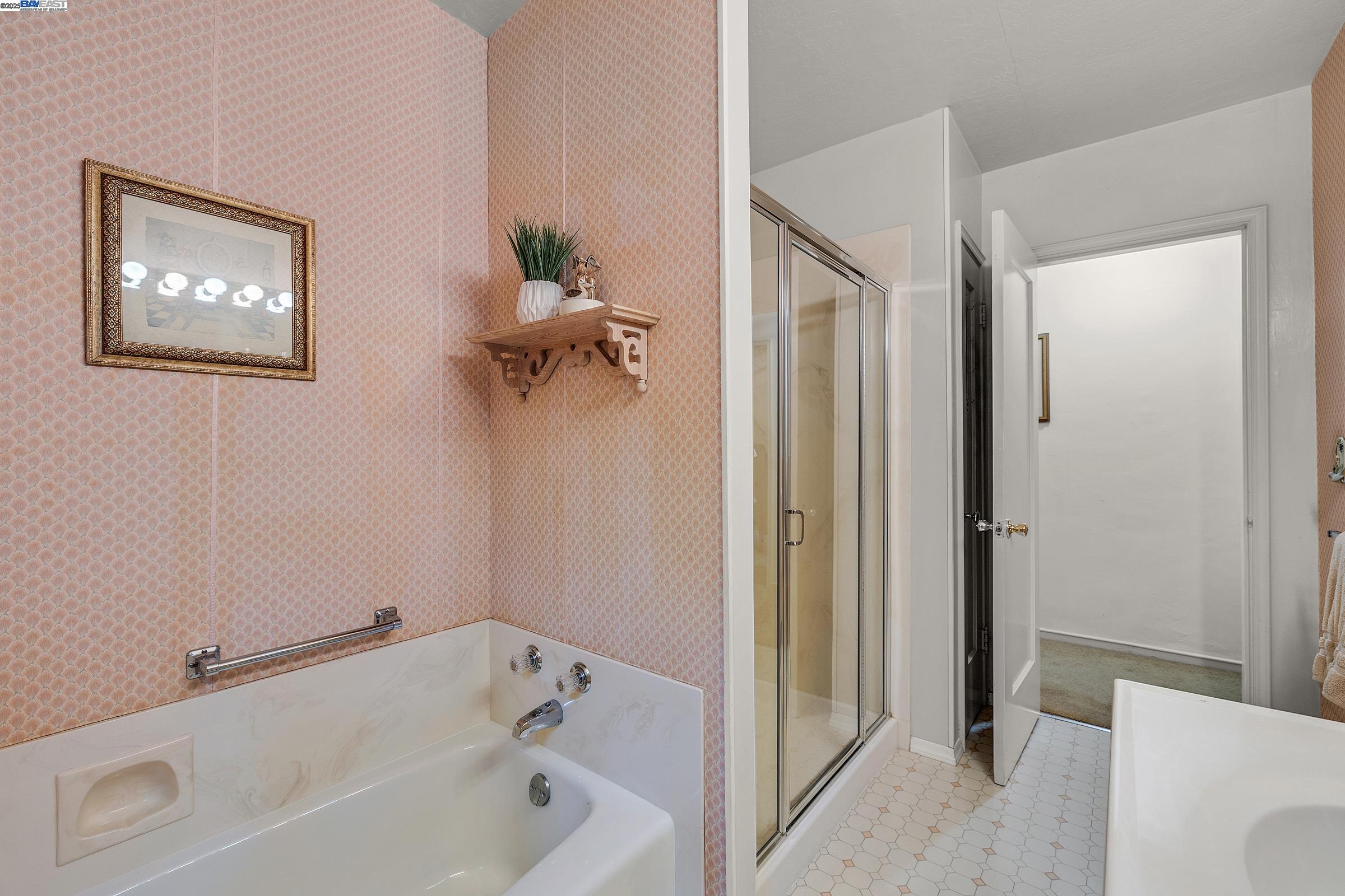 2863 Burton Drive Oakland, CA 94611 - Photo 22 of 34 a white bath tub sitting next to a white toilet