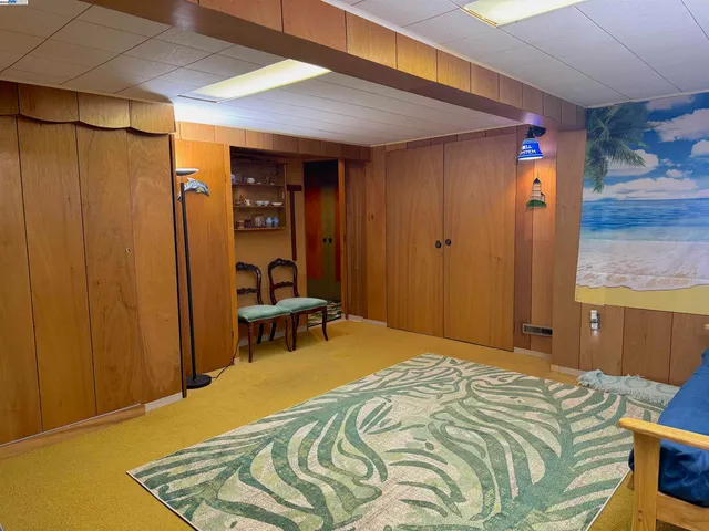 a bedroom with a bed and a table in it