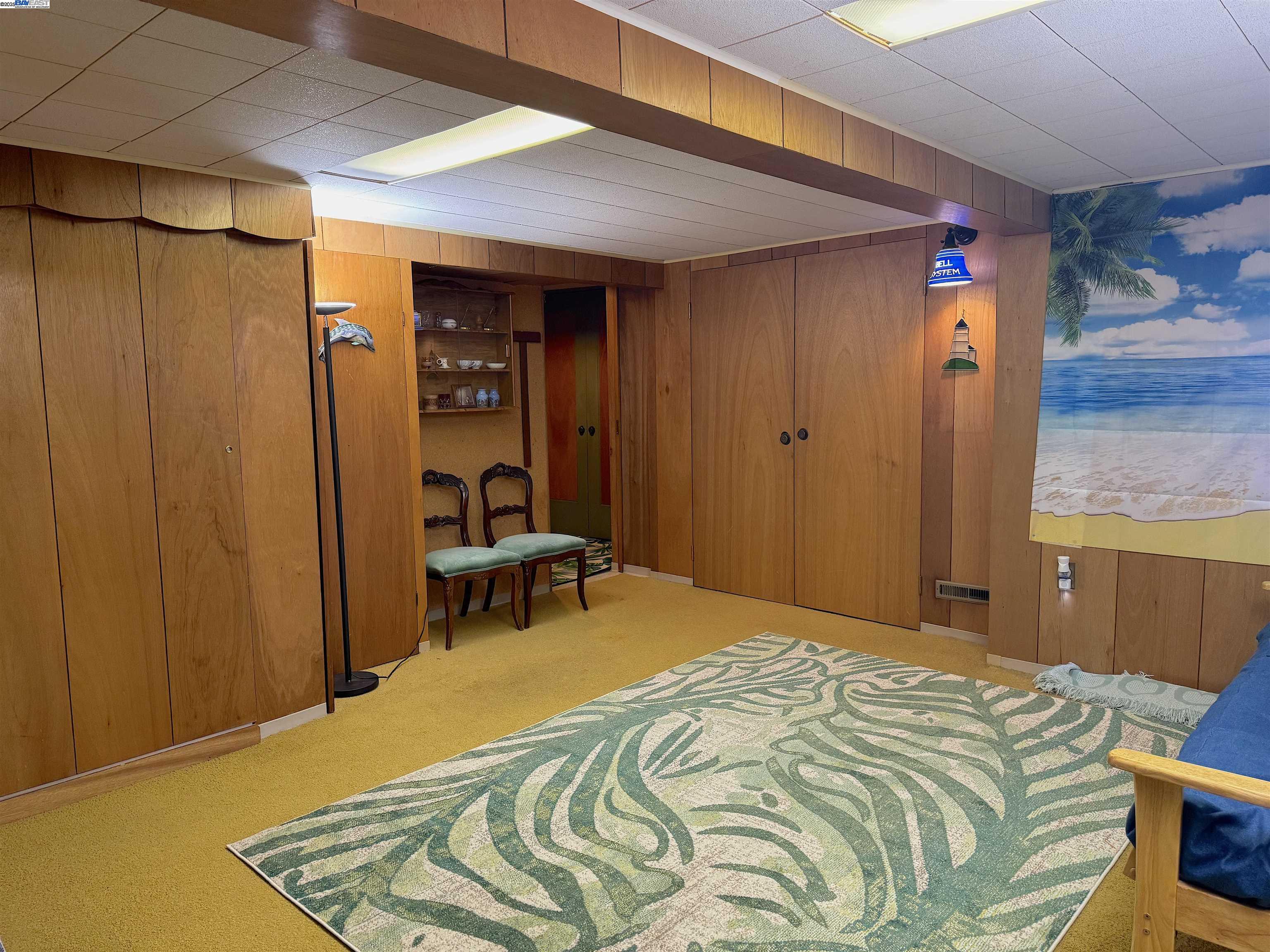 2863 Burton Drive Oakland, CA 94611 - Photo 26 of 34 a bedroom with a bed and a table in it