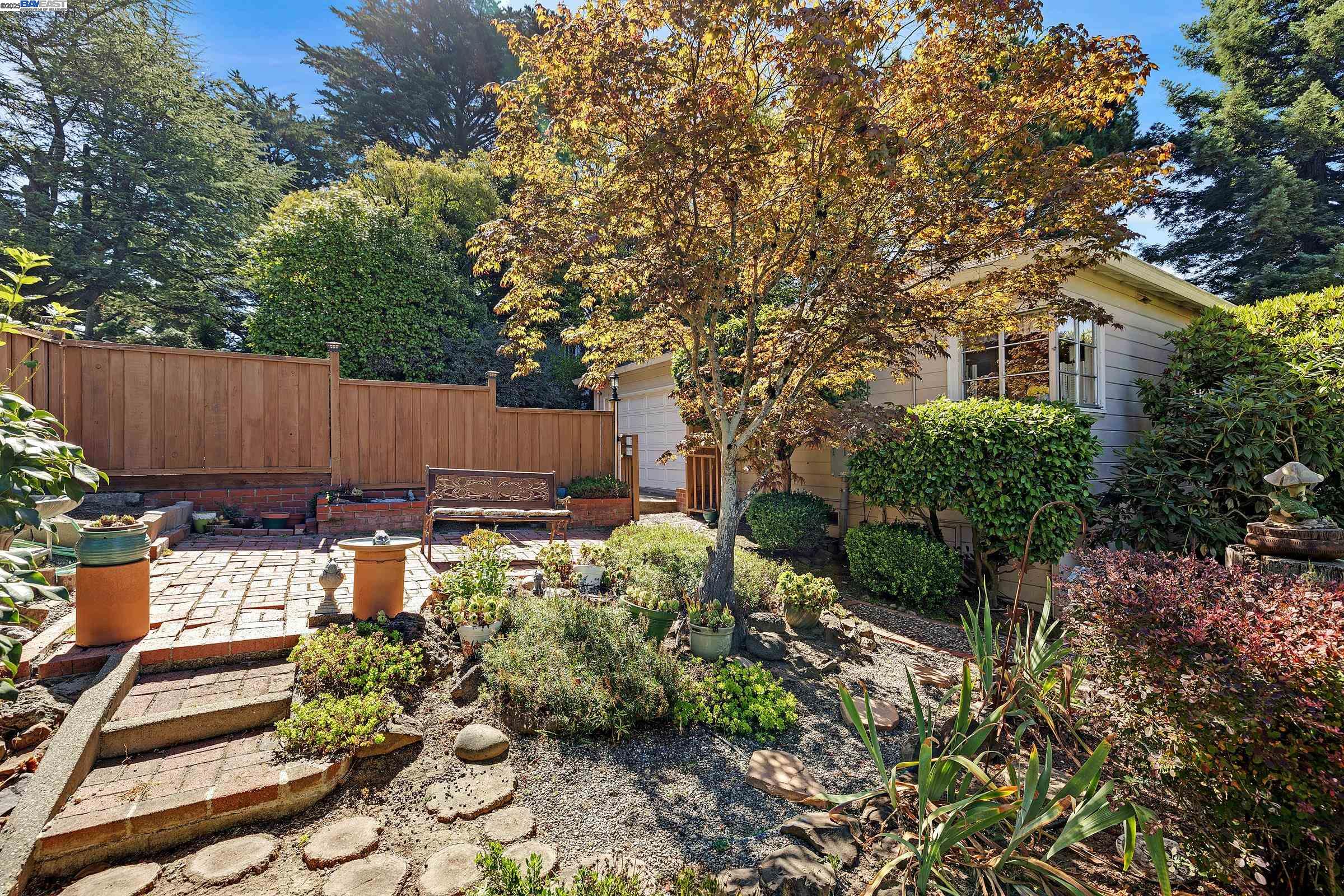 2863 Burton Drive Oakland, CA 94611 - Photo 5 of 34 a view of a backyard with sitting area and garden