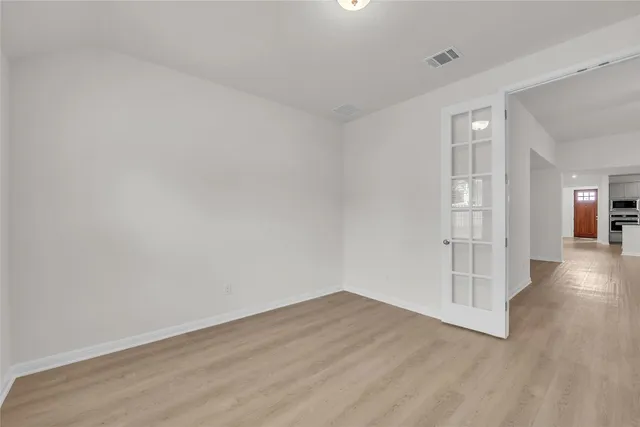 an empty room with windows