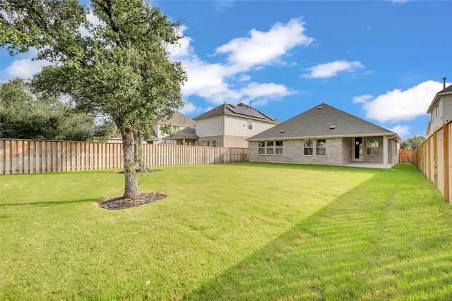 a front view of a house with swimming pool having outdoor seating