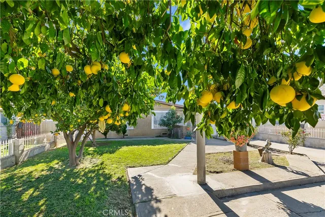 a view of yard with swimming pool and patio